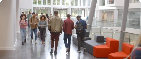 Students walking through a college atrium
