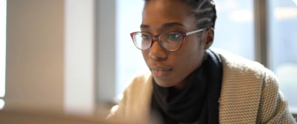 A learner studying at a laptop